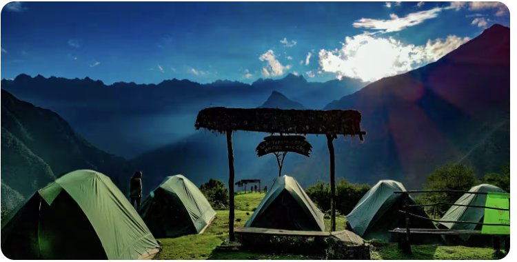 Camping tents at Llactapata with dramatic mountain views at sunrise